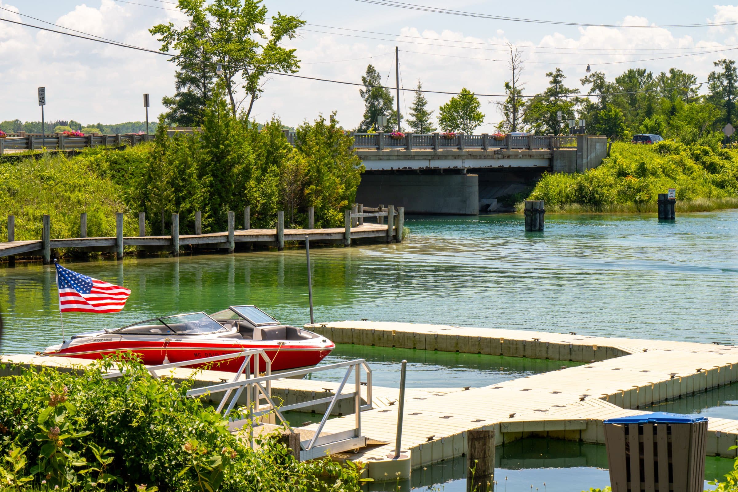 A boat moored at the public launch docks beside the bridge over the Elk River